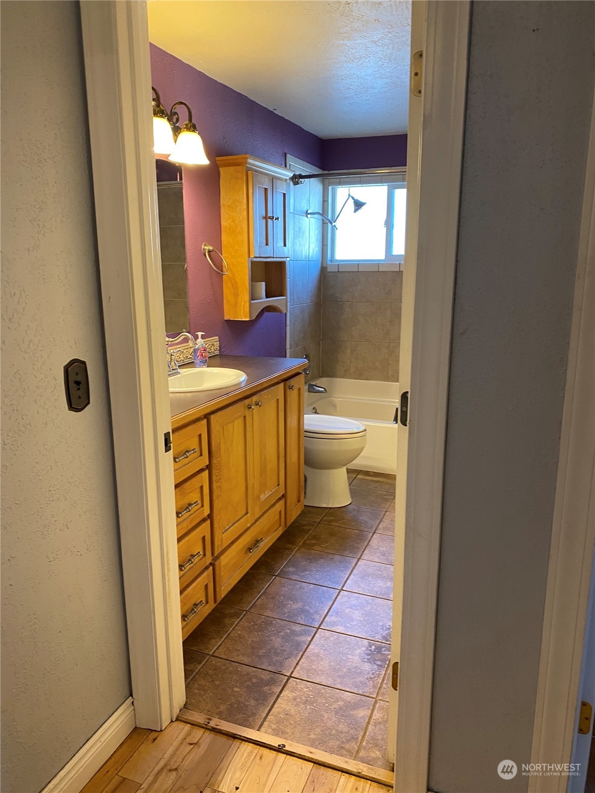 4008 North Marguerite Road Spokane, WA 99212 - Photo 12 of 40 a bathroom with a granite countertop sink and a mirror
