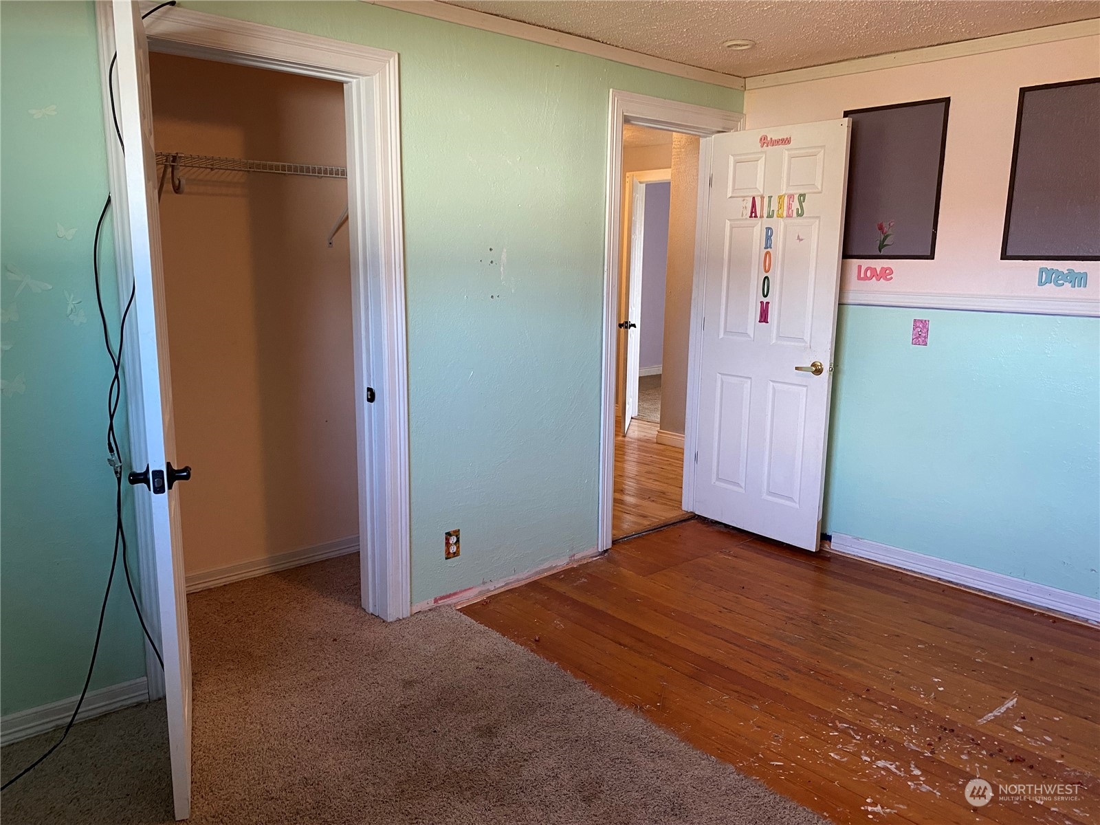 4008 North Marguerite Road Spokane, WA 99212 - Photo 16 of 40 a view of empty room with wooden floor and cabinet