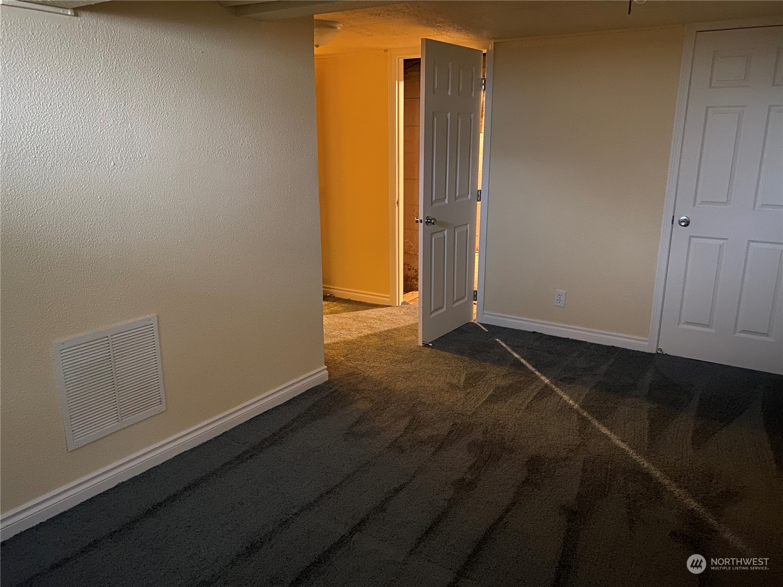 4008 North Marguerite Road Spokane, WA 99212 - Photo 27 of 40 an empty room with an empty space and wooden floor
