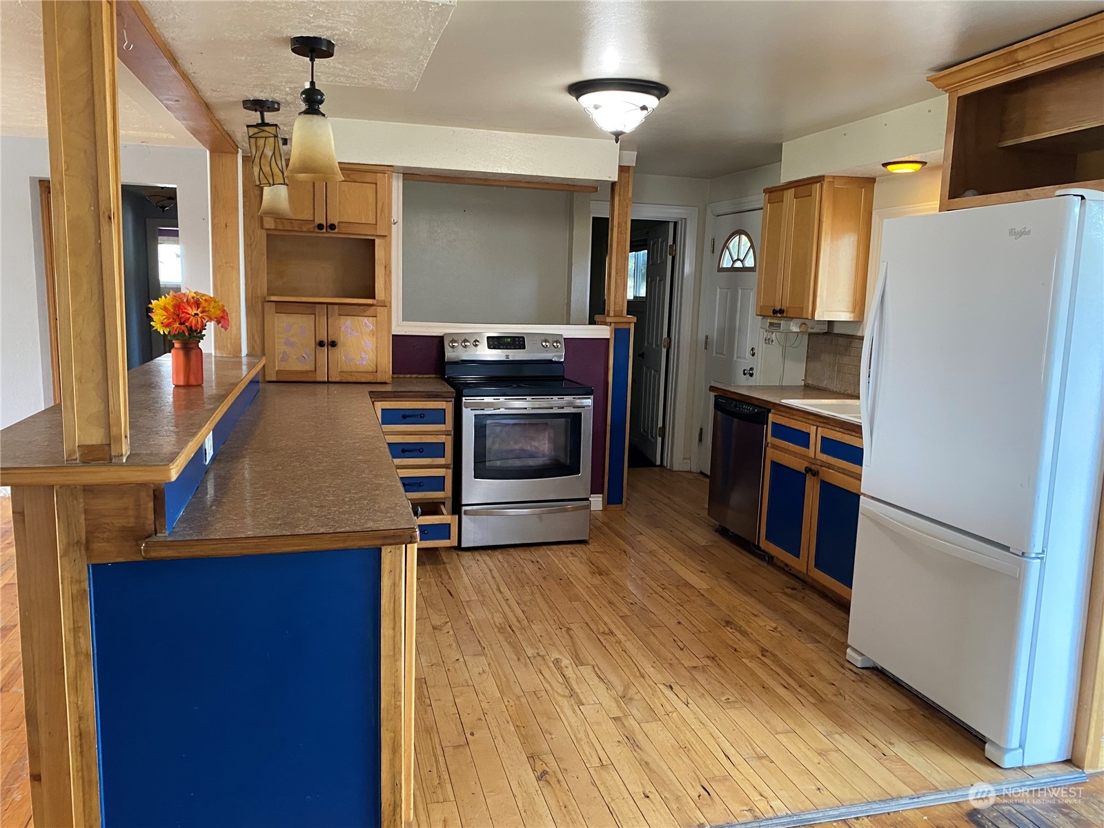 4008 North Marguerite Road Spokane, WA 99212 - Photo 5 of 40 a kitchen with a refrigerator sink and wooden floor