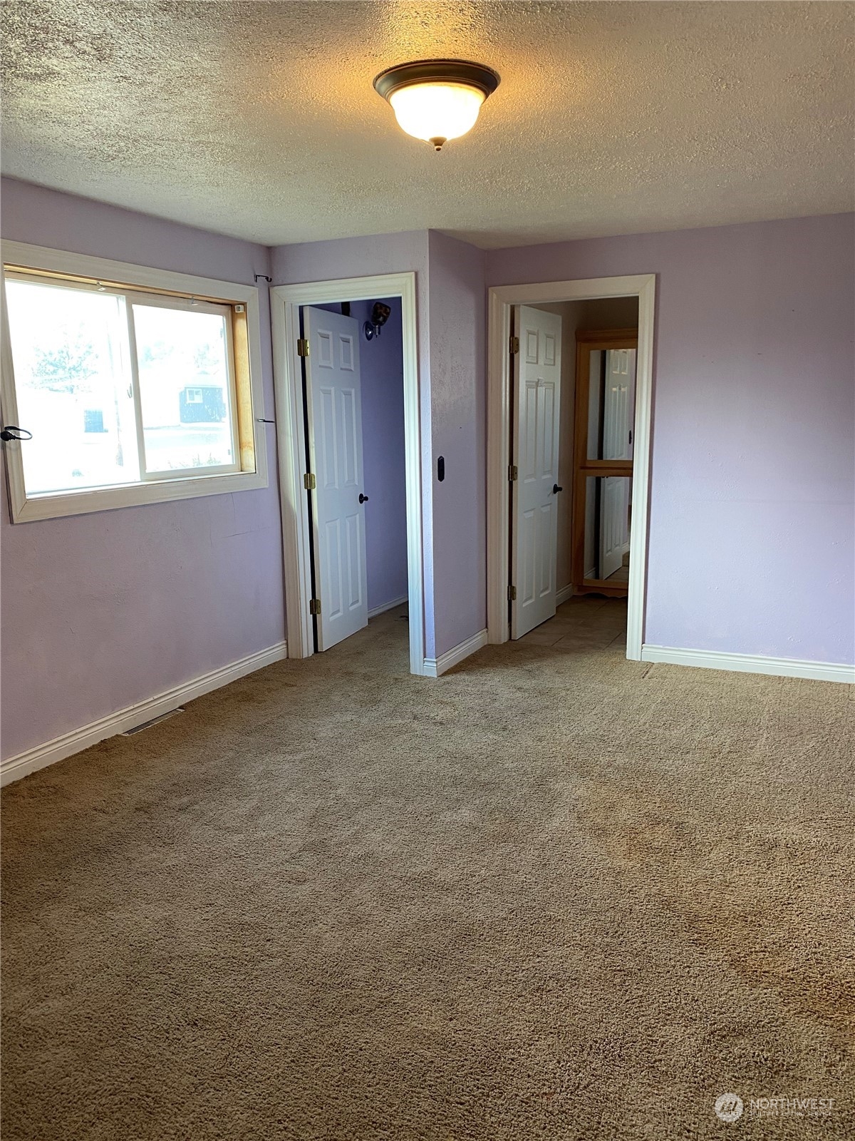 4008 North Marguerite Road Spokane, WA 99212 - Photo 7 of 40 a view of an empty room with a window