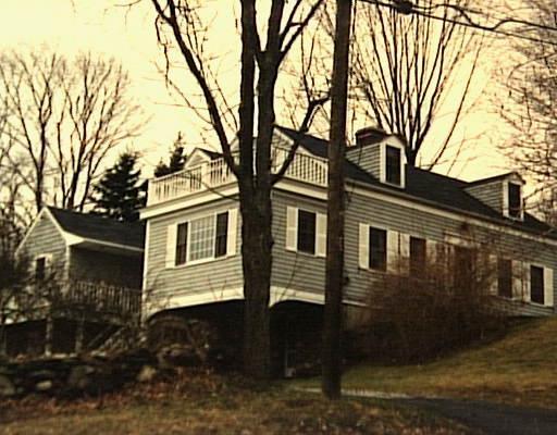 143 Geer Mountain Road Kent, CT 06785 - Photo 1 of 1 a front view of a house with a yard