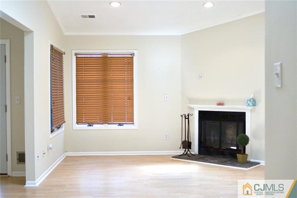 134 Redpine Loop Old Bridge, NJ 08857 - Photo 2 of 12 a view of an empty room with a window