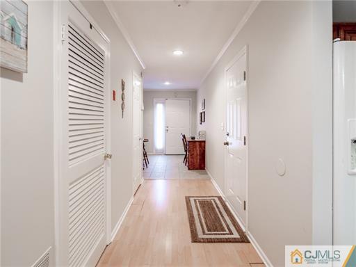 134 Redpine Loop Old Bridge, NJ 08857 - Photo 3 of 12 a view of a hallway with wooden floor