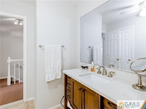 134 Redpine Loop Old Bridge, NJ 08857 - Photo 7 of 12 a bathroom with a sink vanity and a mirror