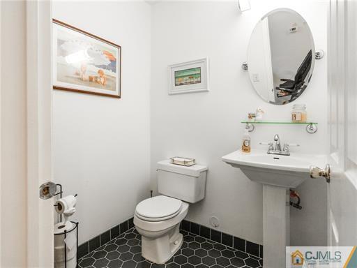 134 Redpine Loop Old Bridge, NJ 08857 - Photo 8 of 12 a bathroom with a toilet sink and mirror
