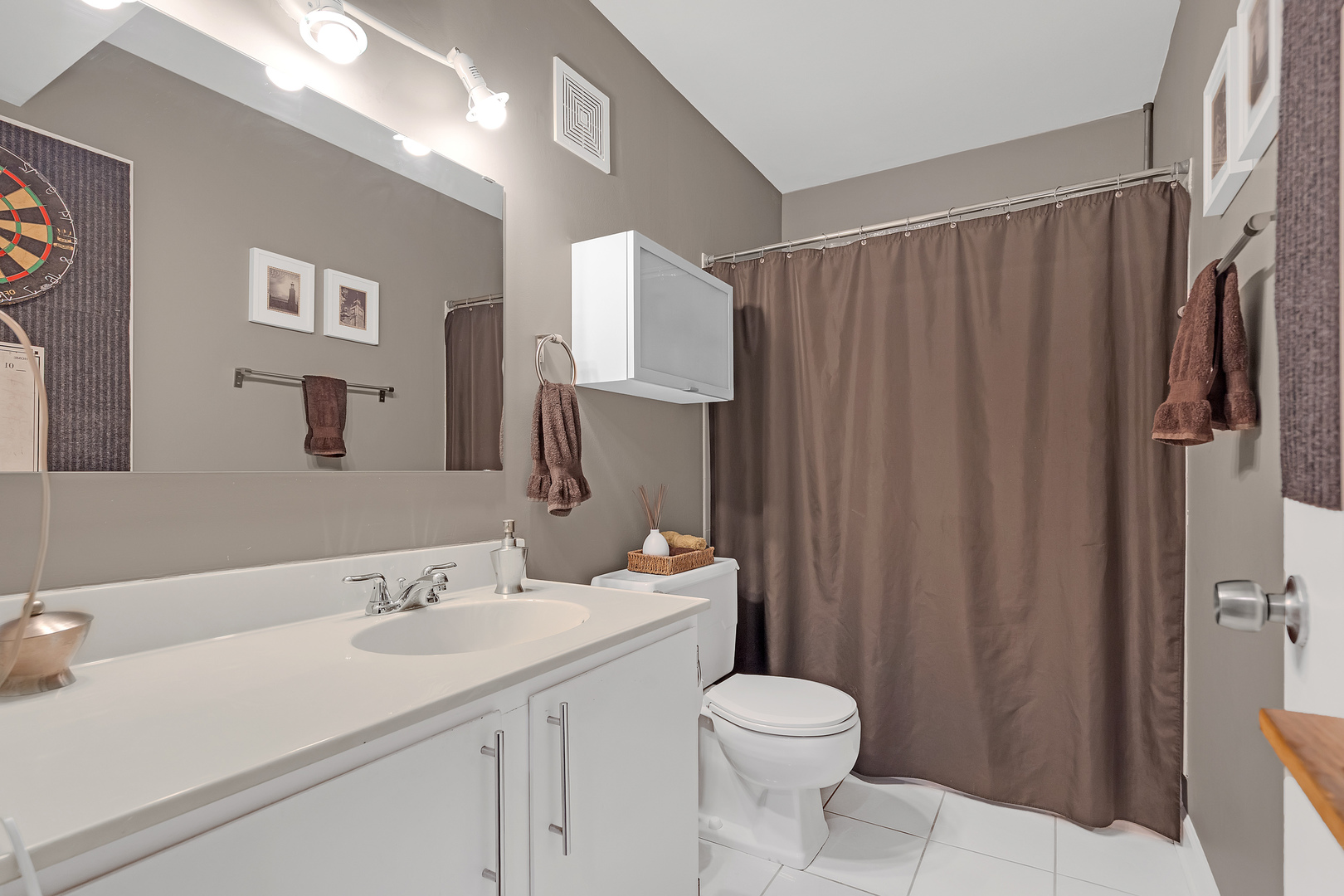 727 Killarney Court, Unit 2D Schaumburg, IL 60193 - Photo 11 of 21 a bathroom with a sink a toilet and shower