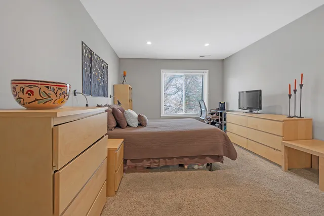 a bed room with a bed and a couch