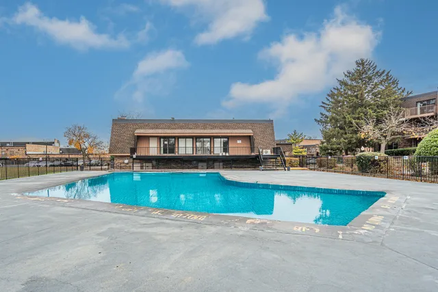 a view of a swimming pool with a lounge chairs