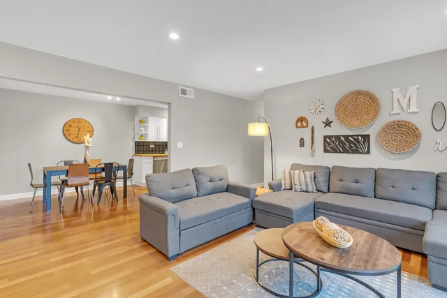 a living room with furniture and a table