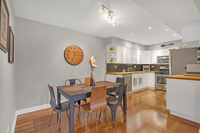 a view of kitchen with cabinets and wooden floor