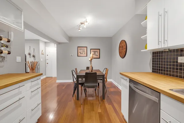 a view of a dining room with furniture and wooden floor
