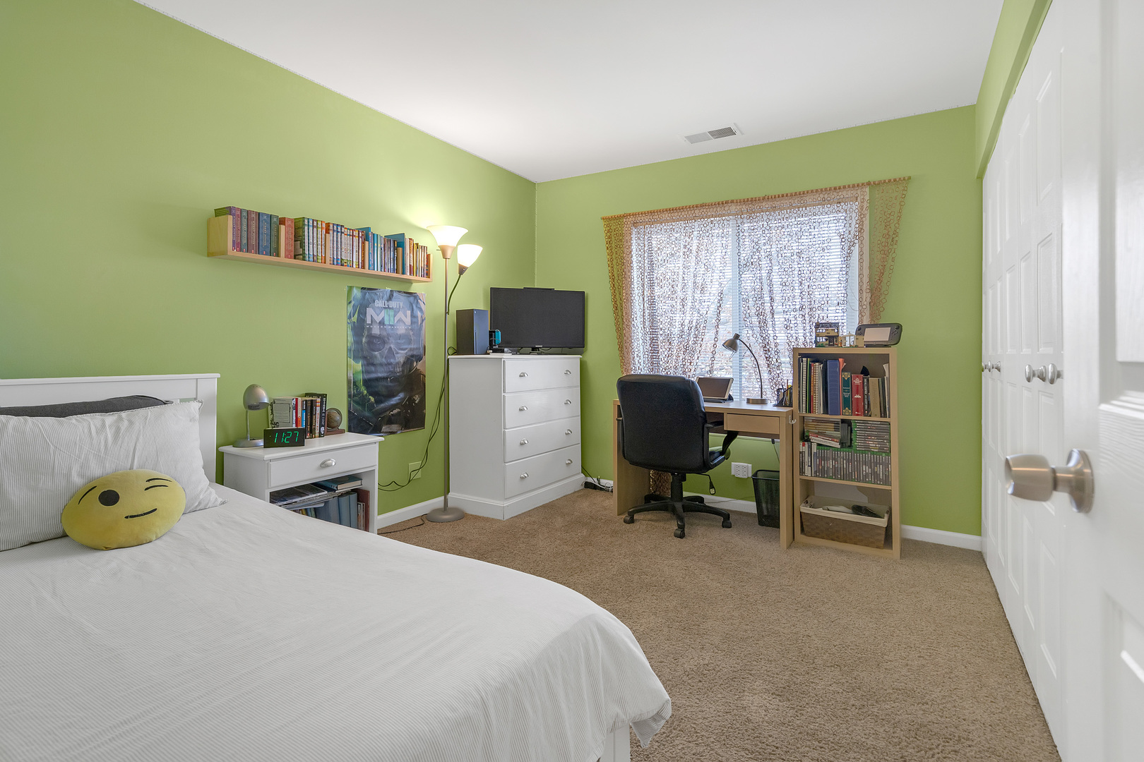 727 Killarney Court, Unit 2D Schaumburg, IL 60193 - Photo 10 of 21 a bedroom with a bed a table and a chair