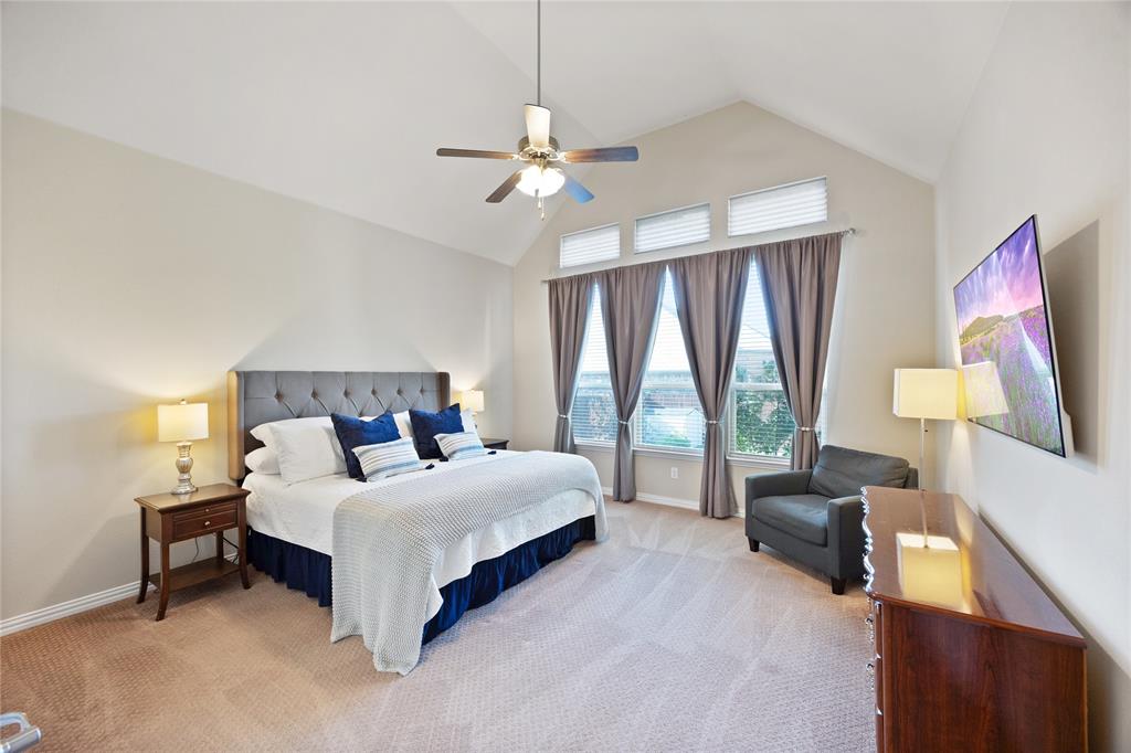 216 Equestrian Road Hickory Creek, TX 75065 - Photo 13 of 26 a bedroom with a bed couch and a large window