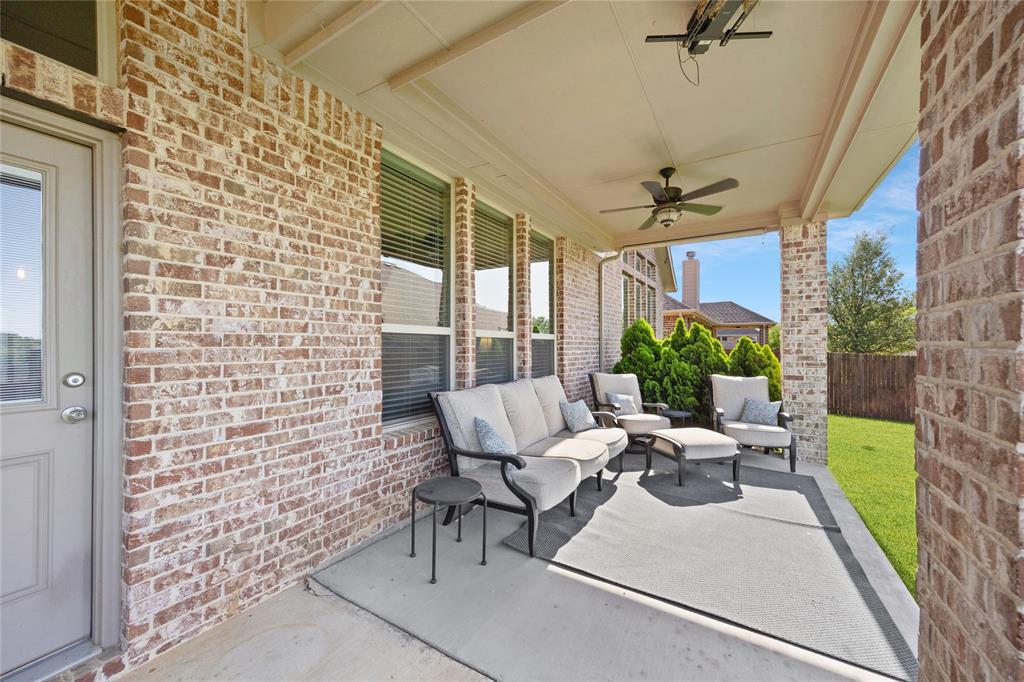 216 Equestrian Road Hickory Creek, TX 75065 - Photo 18 of 26 a view of a patio with table and chairs and potted plants