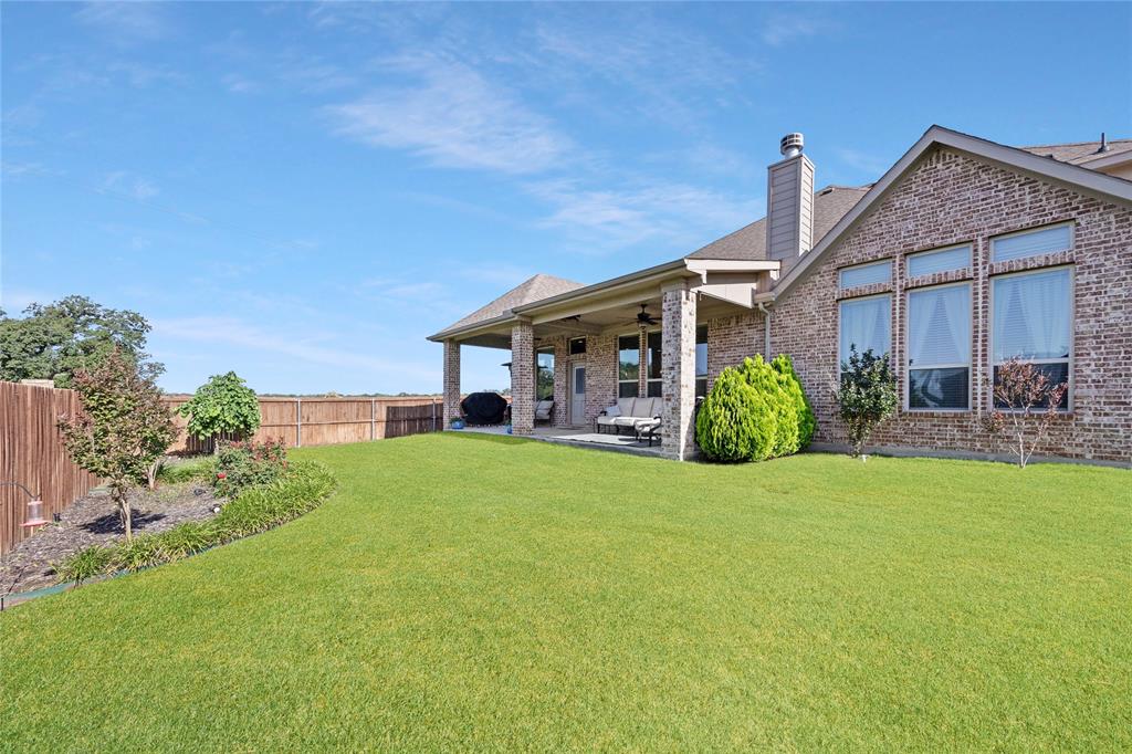 216 Equestrian Road Hickory Creek, TX 75065 - Photo 21 of 26 a view of a house with backyard and porch