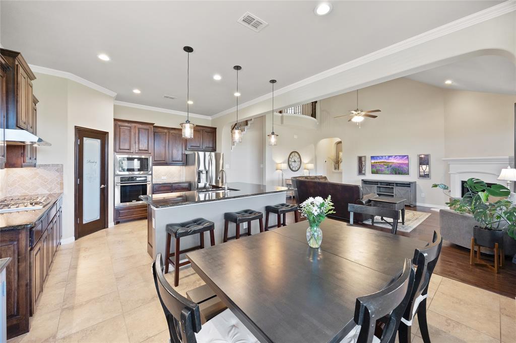 216 Equestrian Road Hickory Creek, TX 75065 - Photo 7 of 26 a living room with stainless steel appliances furniture dining table and chairs