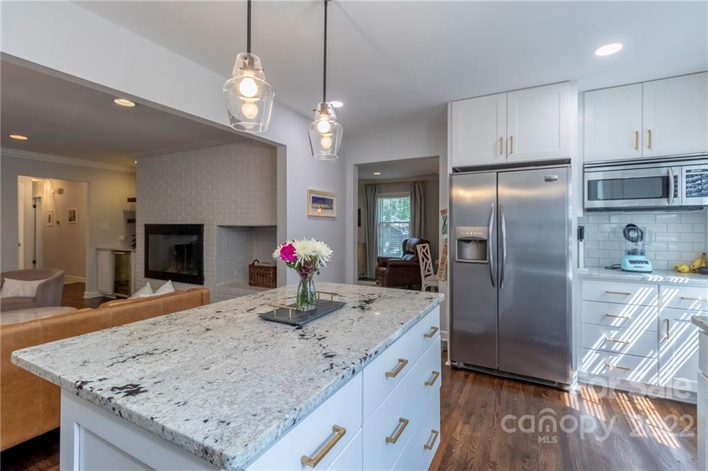 3722 Sulkirk Road Charlotte, NC 28210 - Photo 12 of 37 a kitchen with stainless steel appliances granite countertop a refrigerator a sink and a stove