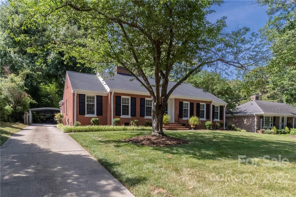 3722 Sulkirk Road Charlotte, NC 28210 - Photo 2 of 37 a front view of a house with a yard