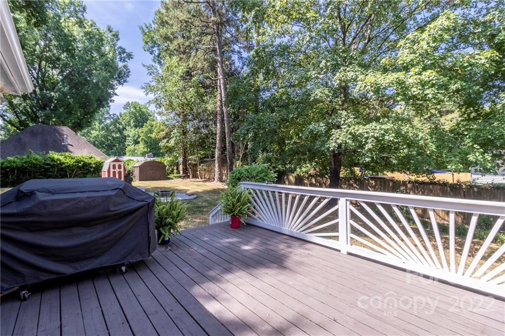 3722 Sulkirk Road Charlotte, NC 28210 - Photo 30 of 37 a view of a deck with two chair and wooden floor