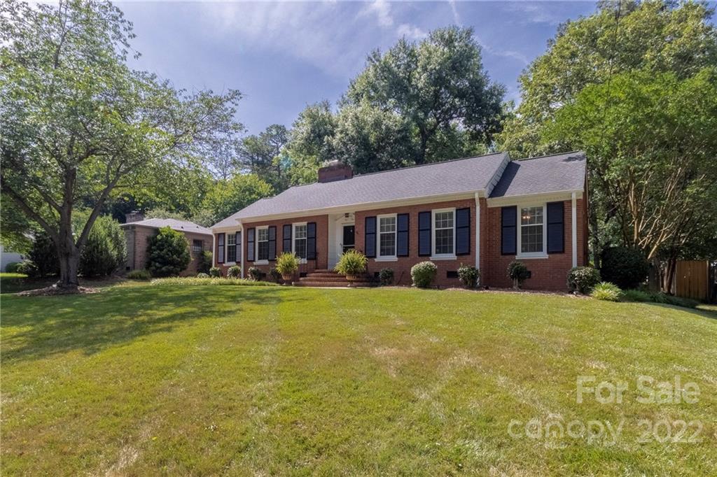 3722 Sulkirk Road Charlotte, NC 28210 - Photo 3 of 37 a front view of a house with a garden
