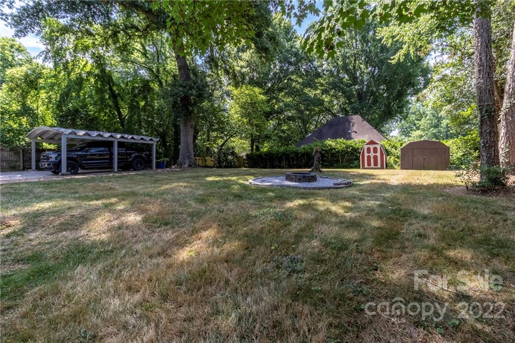 3722 Sulkirk Road Charlotte, NC 28210 - Photo 32 of 37 a view of a house with backyard and trees