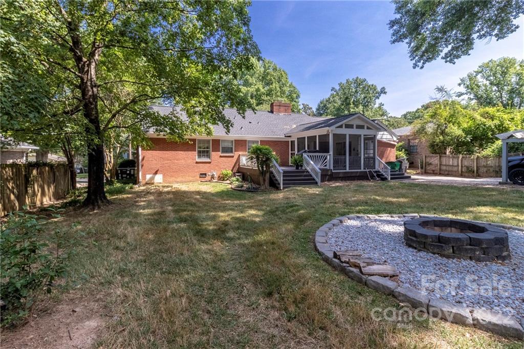 3722 Sulkirk Road Charlotte, NC 28210 - Photo 35 of 37 a view of a house with backyard porch and sitting area