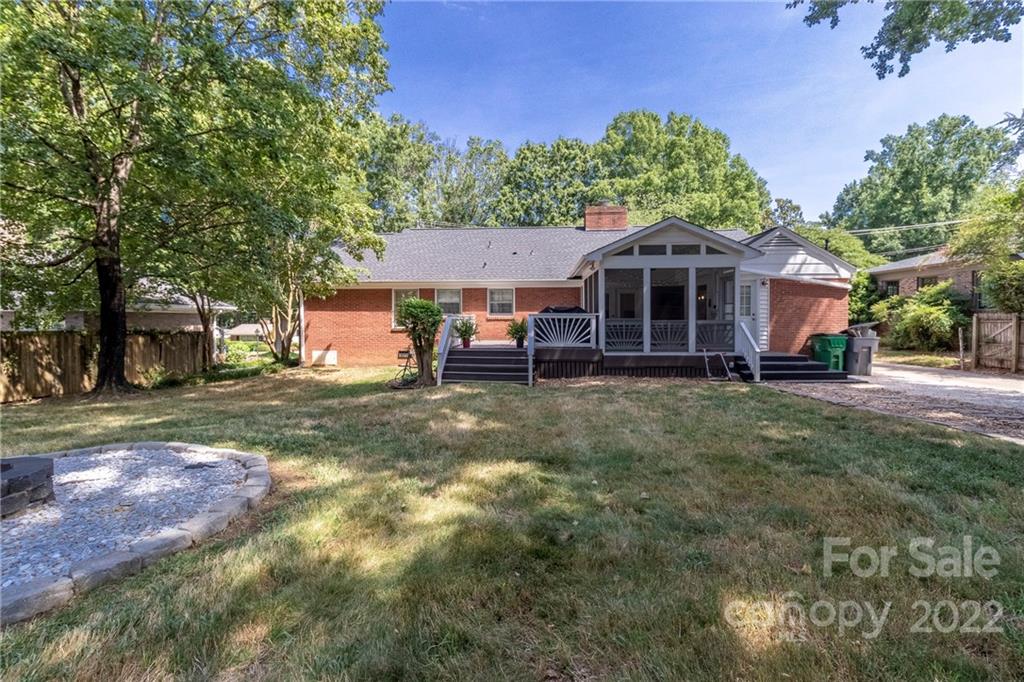 3722 Sulkirk Road Charlotte, NC 28210 - Photo 36 of 37 a front view of a house with a yard