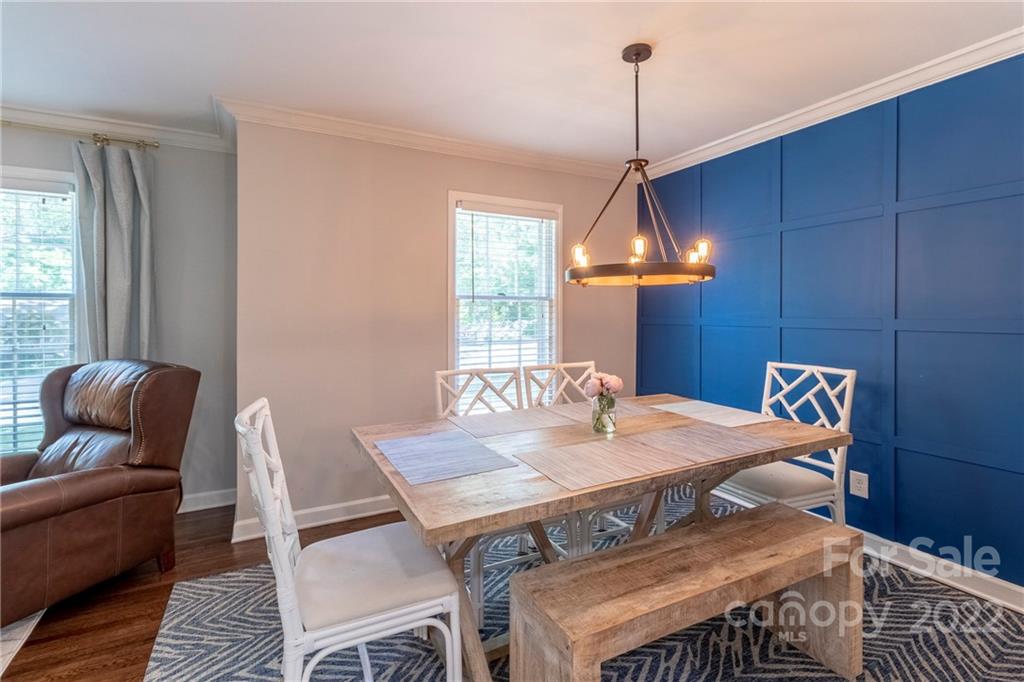 3722 Sulkirk Road Charlotte, NC 28210 - Photo 9 of 37 a view of a dining room with furniture window and wooden floor