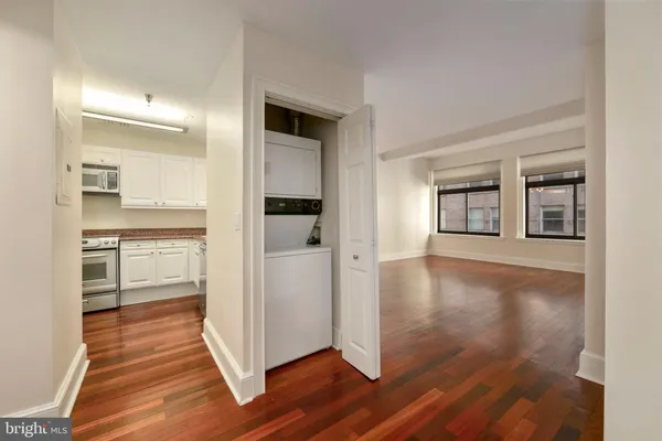 a view of a kitchen cabinets and wooden floor
