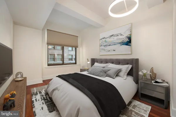 a bedroom with bed and a window