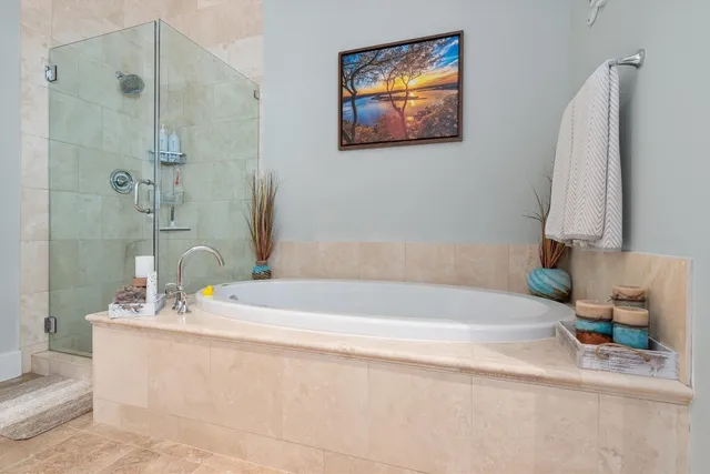 a bathroom with a bathtub and a sink