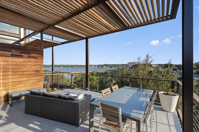 a view of a balcony with furniture