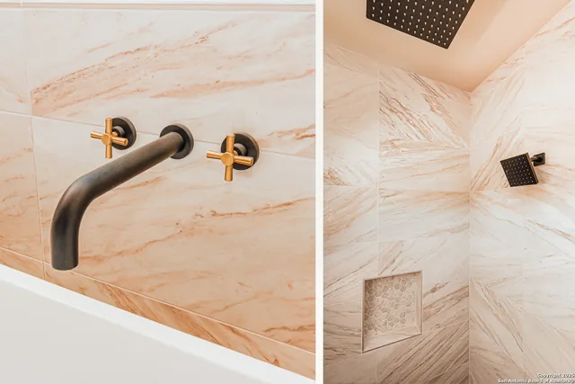 a bathroom with a tub sink shower and mirror