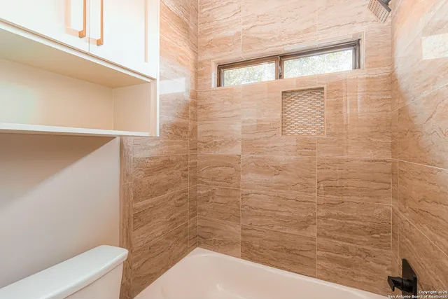 an empty room with windows lake and mountain view