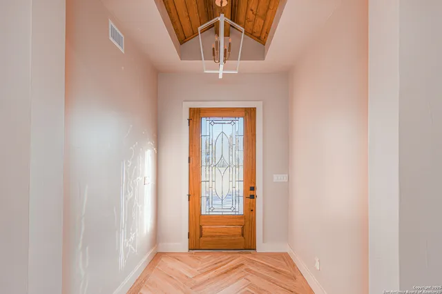 a view of bedroom with a bed and wooden floor