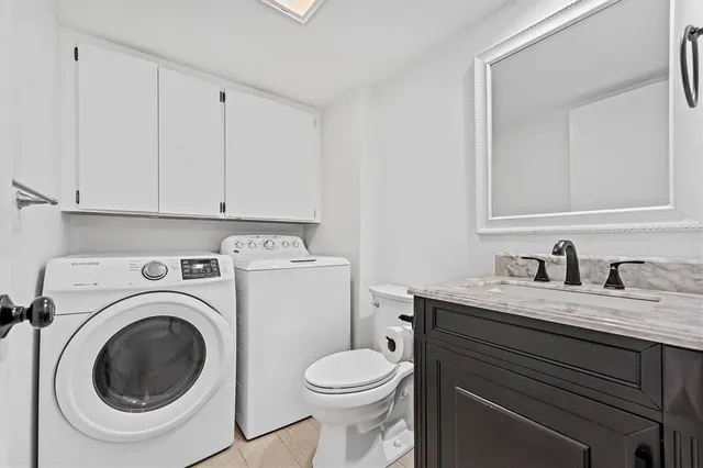 a view of a bathroom with a washer and dryer
