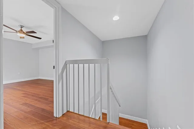 a view of bedroom with wooden floor