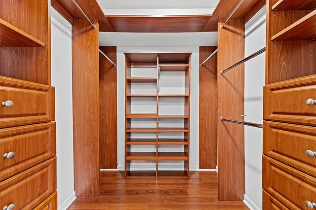 a view of closet area with empty racks