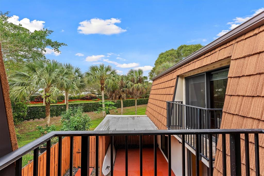 9156 Southwest 23rd Street, Unit D Davie, FL 33324 - Photo 28 of 35 a view of a wooden deck and a yard