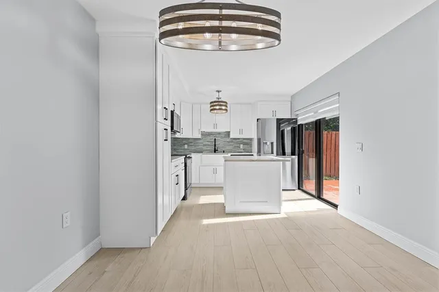 a view of a kitchen with a sink