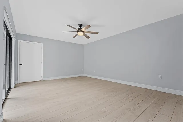 a view of empty room with fan