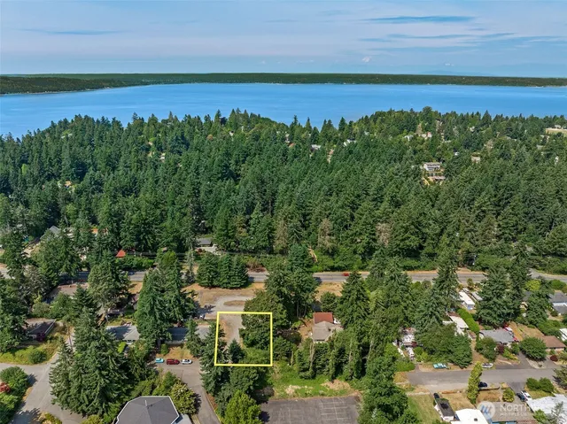 a view of a lake with a yard