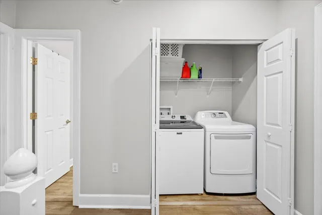 a view of storage and utility room with washer and dryer