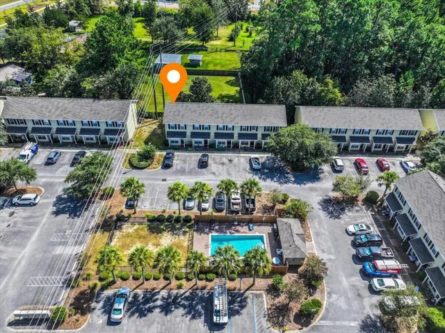 an aerial view of a house with yard swimming pool and outdoor seating