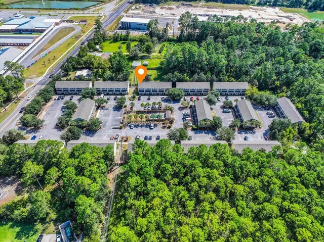 an aerial view of multiple house with yard