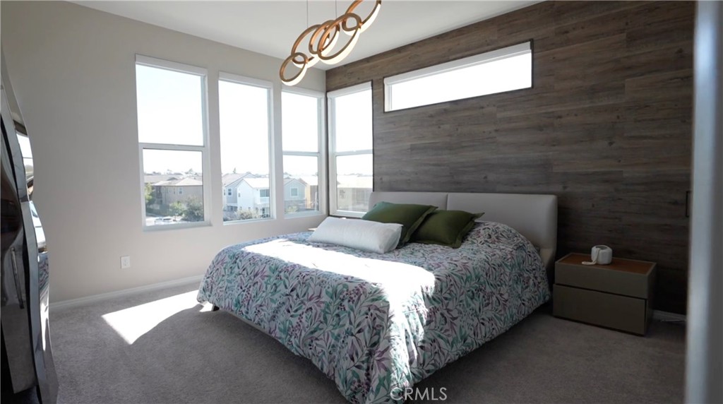 201 Merit Irvine, CA 92618 - Photo 6 of 8 a bedroom with a bed and a large window