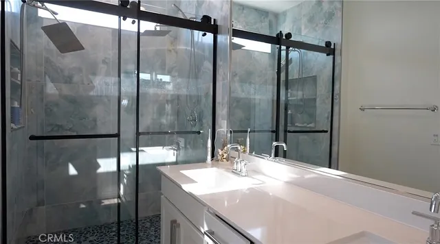 a bathroom with a sink and mirror