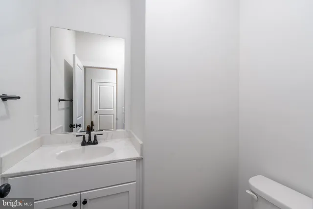 a bathroom with a bathtub a window a shower and vanity