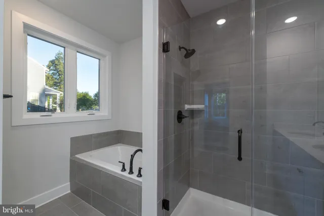 a view of an empty room and wooden floor